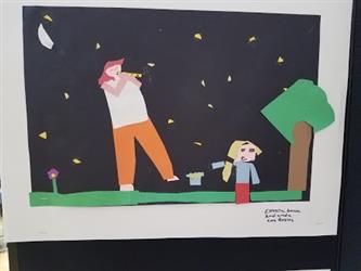 Student art project of an male adult and a male child standing on the grass need a tree in the night sky made of black, yellow, white, green, red, blue and purple paper strips.